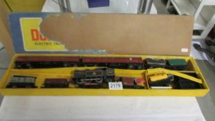 A Hornby locomotive, carriages and rolling stock.