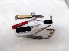 A quantity of penknives including a silver one