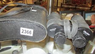 A cased pair of Dioptex 15 x 50 binoculars.