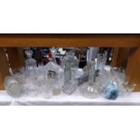 A good lot of glassware including a ships decanter & an unusual goldfish bowl