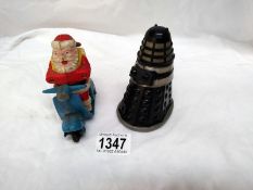 A 1960's Marx Toys friction Dalek and a Hong Kong Santa on scooter