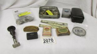 A mixed lot including brass buckles, miniature snuff box, coins, match boxes etc.,