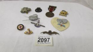 A mixed lot of military badges etc.,
