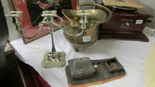A spelter desk stand, a silver plate candelabra and a small brass scuttle.