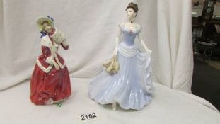 A Royal Doulton figure Christmas Morn HN1992 and a Coalport figure, Victoria.