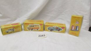 Four boxed Atlas Dinky models including 111 Triumph TR2, Morris Mini Traveller etc.,