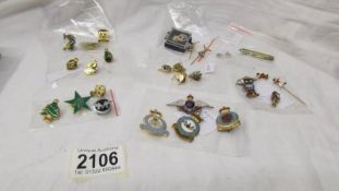 An interesting lot of pins & badges including R.A.F, Royal Ulster Constabulary, Rupert, Golly etc.,