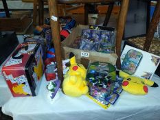 A quantity of Pokemon related cards, tins and toys.