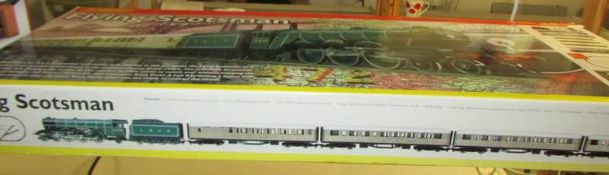 A Hornby Flying Scotsman electric train set and a goods shed.