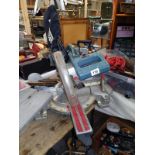 An Erbauer angle 10" sliding mitre saw with blades.