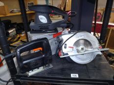 A boxed Performance Orbital sander and a Black and Decker jigsaw and a circular saw.