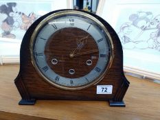 A mantlepiece chiming clock
