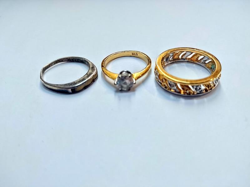 A silver and opal ring, an eternity ring and a dress ring. - Image 2 of 2