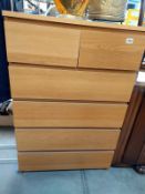 A pine effect bedroom chest of drawers. 81cm x 49cm x height 123cm. COLLECT ONLY.