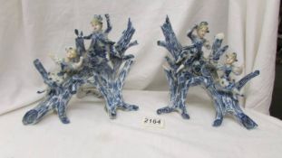 Two Victorian figural blue and white spill vases.