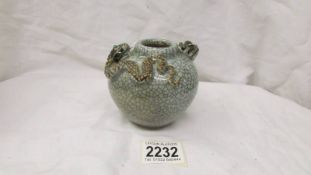 A Chinese pot/vase with rat and snake decoration.