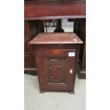 An oak pot cupboard with carved door. COLLECT ONLY.