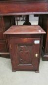 An oak pot cupboard with carved door. COLLECT ONLY.