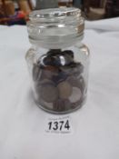 A jar of mainly foreign coins