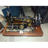 A decorative cased Singer sewing machine