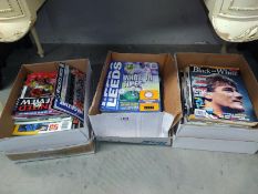 A quantity of Manchester United football programmes and Black & White magazines etc.