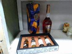 A boxed connoisseur whisky tasting experience and a bottle of Martell Cognac.