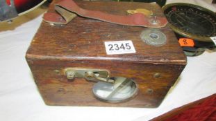 A cased pigeon clock.