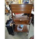 A teak dining/ cutlery trolley and a 2 tier trolley.