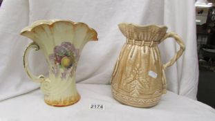 A Falconware jug and an Arthur Wood jug.