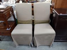 A pair of dining room chairs with covers COLLECT ONLY