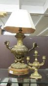 A metal table lamp with swan decoration (a/f) and a brass candelabra. COLLECT ONLY.
