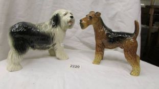 A Coopercraft terrier and an Old English sheep dog.