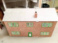 A large 'ready to finish' Doll's house with opening roof and back.