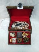 A small chest of costume jewellery, watches and pearls