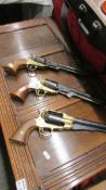 Three replica colt pistols.
