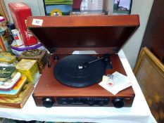 A retro unbranded wooden cased record player radio 44cm x 35cm x 13cm