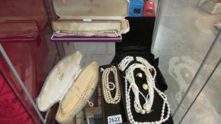 A good lot of pearl and faux pearl necklaces.