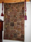 An early Rabari patchwork wall hanging with mirrored discs (91.5 x 163.5 cm)