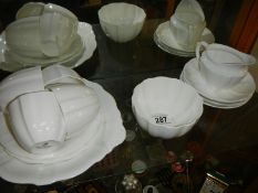 12 pieces of white Royal Crown Derby tea ware.