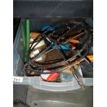 A box of tools, paint brushes, grease gun etc.,