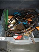 A box of tools, paint brushes, grease gun etc.,