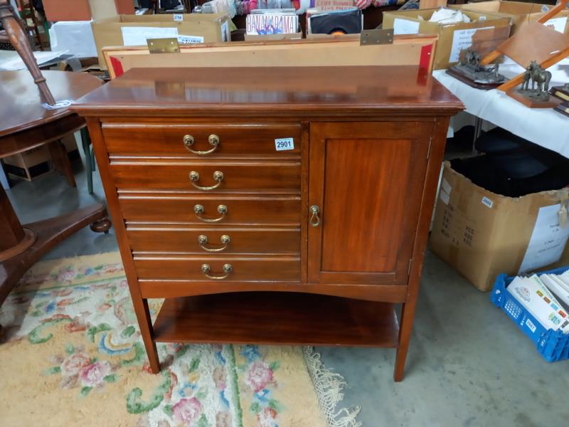 An unusual mahogany music cabinet with five drawers and single door. COLLECT ONLY.