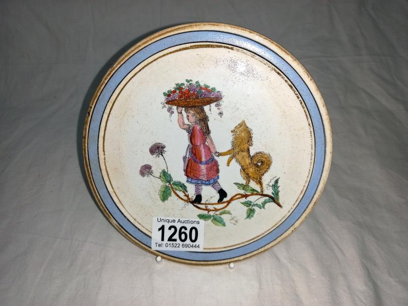 An interesting early hand painted plate girl with dog