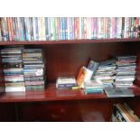 A shelf of CD's including The Rat Pack, Mumford and Sons etc.,
