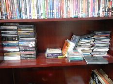 A shelf of CD's including The Rat Pack, Mumford and Sons etc.,