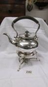 A silver plate spirit kettle complete with burner.
