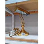 A brass bankers desk lamp