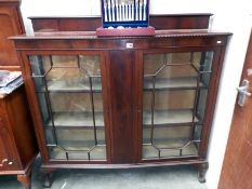 An Edwardian mahogany display cabinet with astragal glazed doors 138cm x 41cm x 135cm high COLLECT