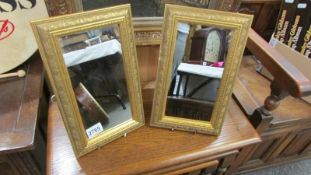 A pair of gilt framed mirrors. COLLECT ONLY.