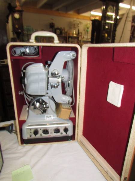 A Cirse Sound 35mm projector, speaker in side of box editing machine and a spare lense,